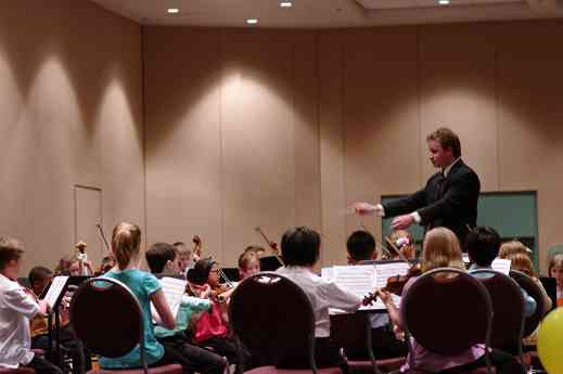 Emmett Drake conducts the SYOA 1 concert at the 2012 conference