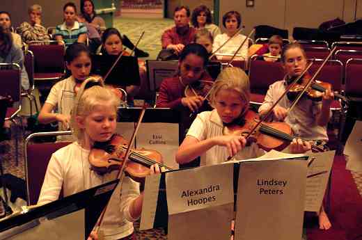 SYOA violin section hard a practice at the 2002 SAA Conference.