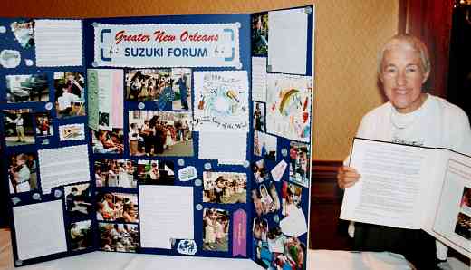 Kathleen Tyree, Director of Greater New Orleans Forum, with photos of fund-raisers, cards and letters after hurricane Katrina.