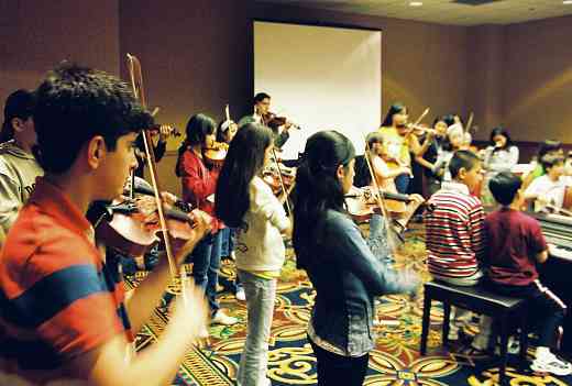 Latin American Suzuki Ensemble in rehearsal.