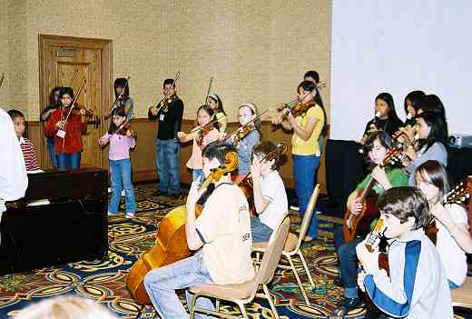 The Latin American Suzuki Ensemble rehearses some more.