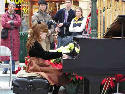 Suzuki piano student gives a holiday performance