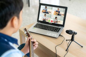 Asian Boy Playing Guitar