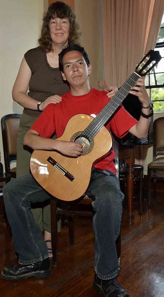 MaryLou Roberts and teacher David with donated guitar