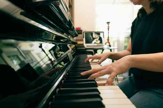 Person on Playing Piano with Computer